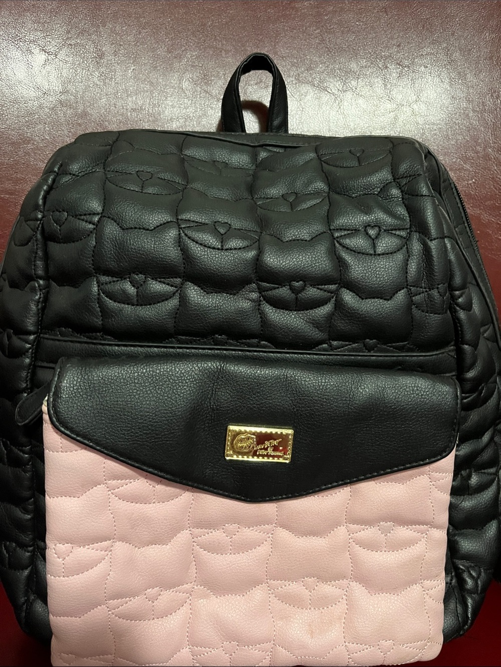 Betsy JohnsonQuilted Black and Pink Women's Backpack with Gold Plaque
